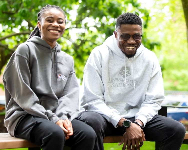 Students wearing grey Strathclyde merch hoodies